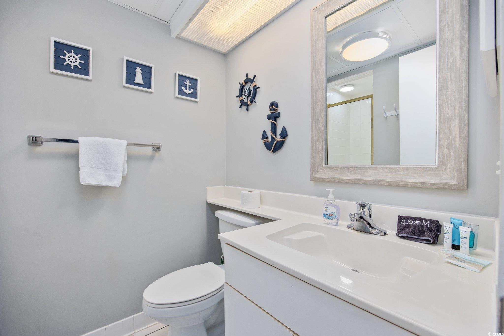 161 Seawatch Drive, Unit 1117 Myrtle Beach, SC 29572 - Photo 6 of 33 Bathroom featuring vanity, a shower with door, and