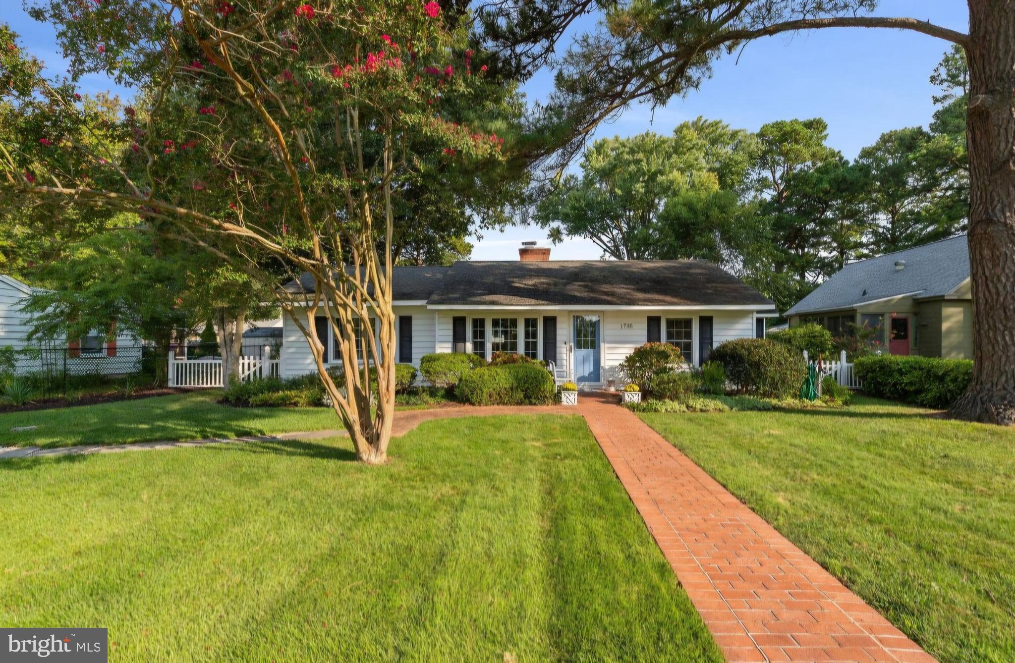 1705 Hambrooks Boulevard Cambridge, MD 21613 - Photo 1 of 22 a view of house with a big yard and large trees