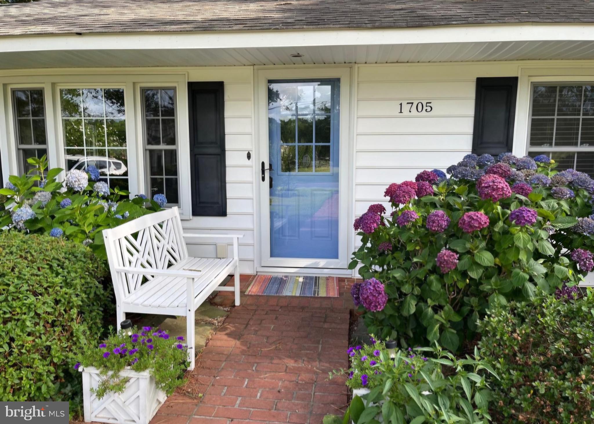 1705 Hambrooks Boulevard Cambridge, MD 21613 - Photo 2 of 22 a view of a bench sitting in front of a house