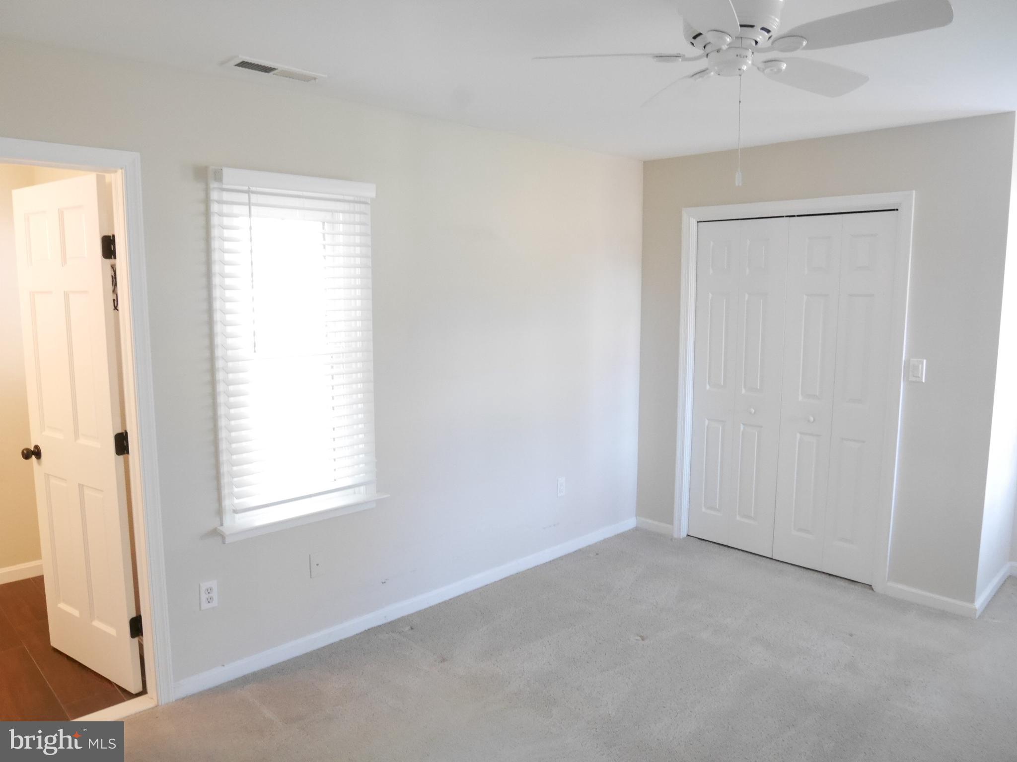 1705 Hambrooks Boulevard Cambridge, MD 21613 - Photo 10 of 22 an empty room with windows and closet
