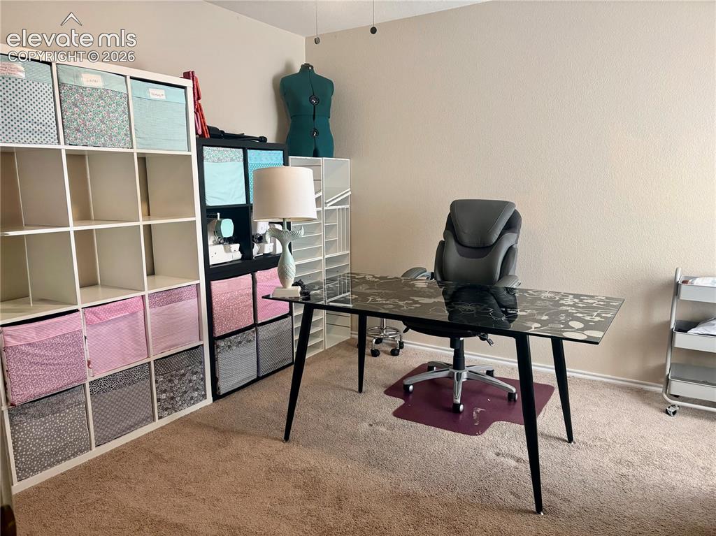 3748 Riviera Grove, Unit 203 Colorado Springs, CO 80922 - Photo 15 of 26 a living room with furniture
