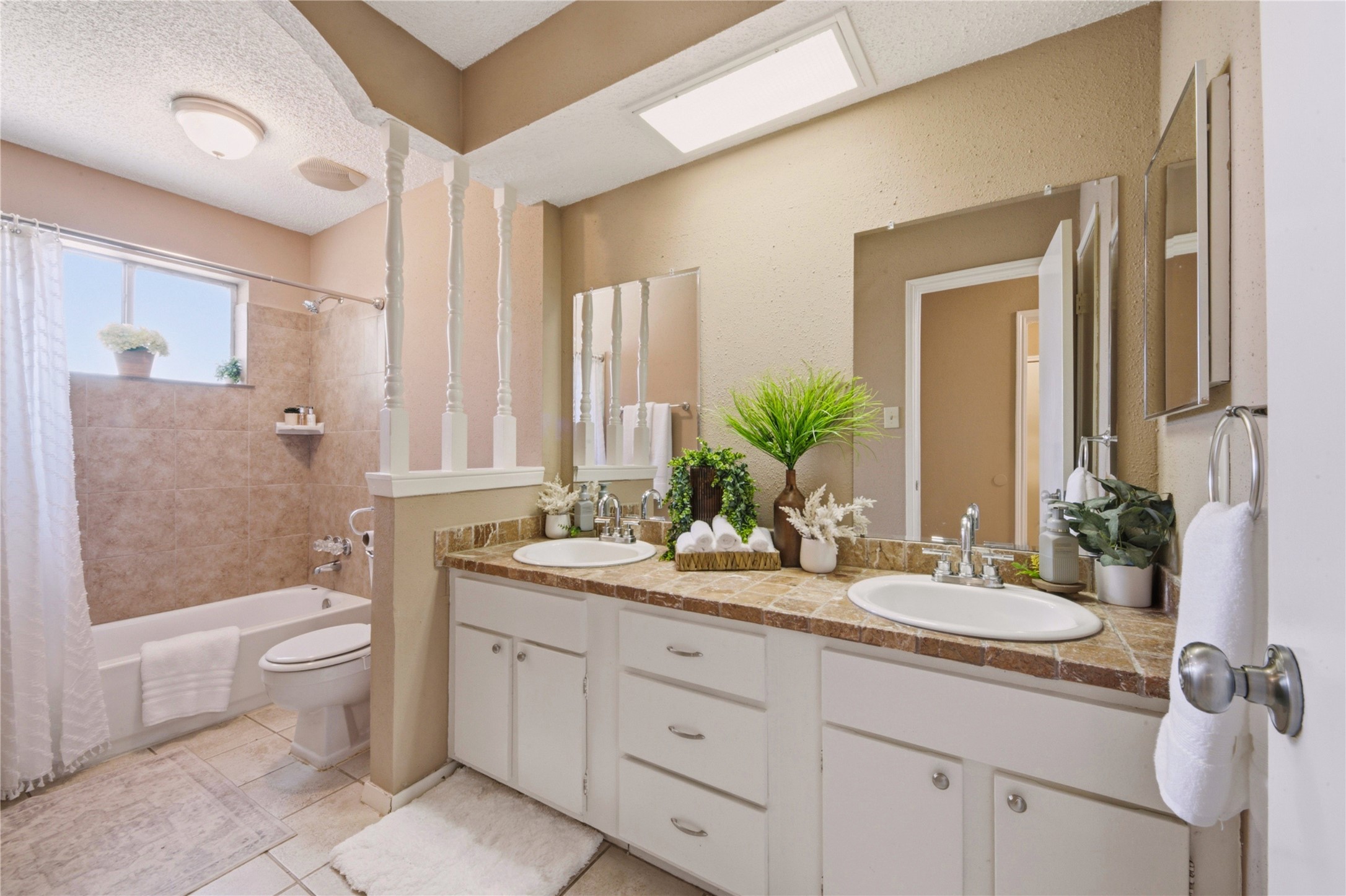 4019 Postwood Drive Spring, TX 77388 - Photo 22 of 50 a bathroom with a double vanity sink toilet and shower
