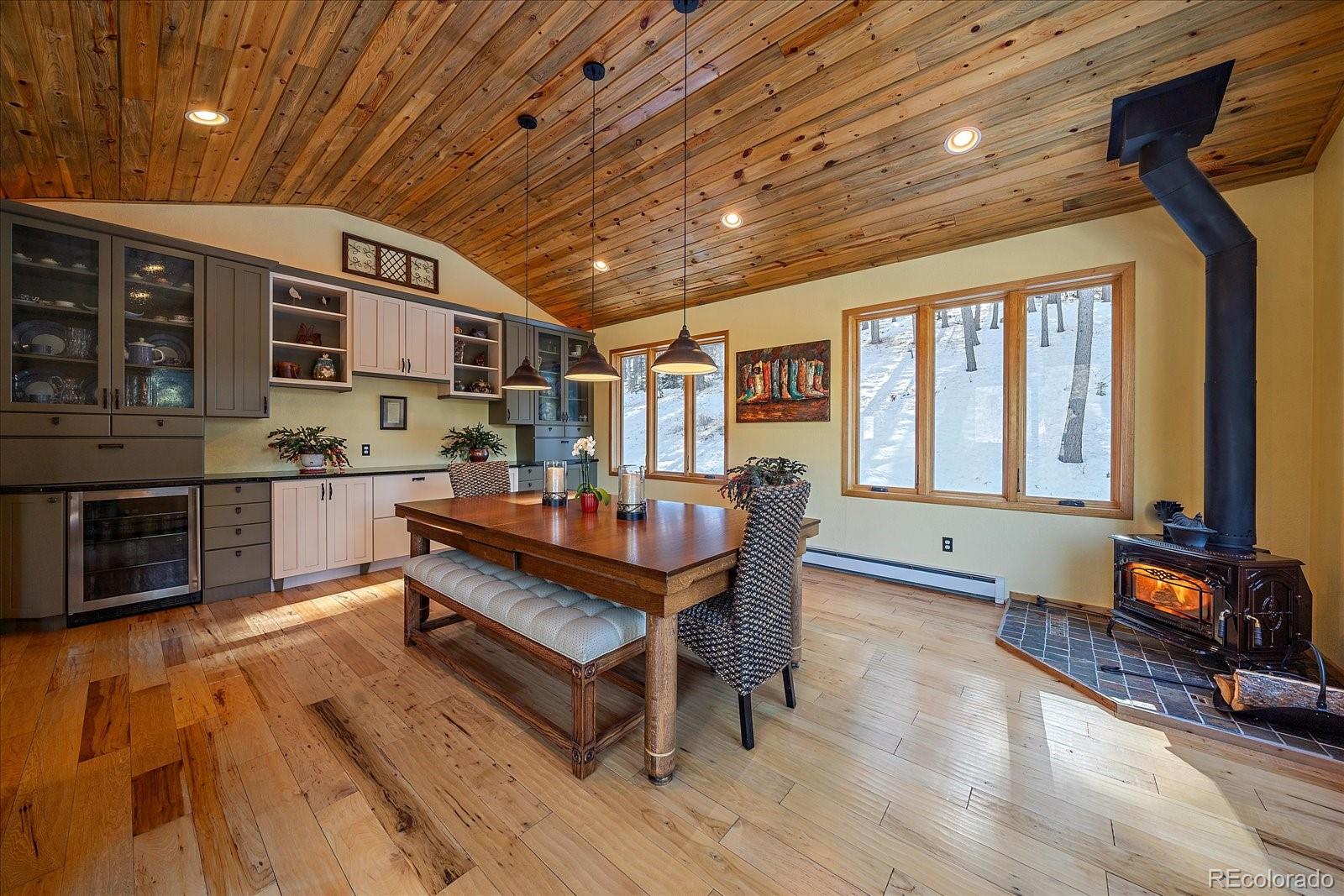 31196 Roberts Road Pine, CO 80470 - Photo 13 of 50 a room with furniture pool table wooden floor and windows