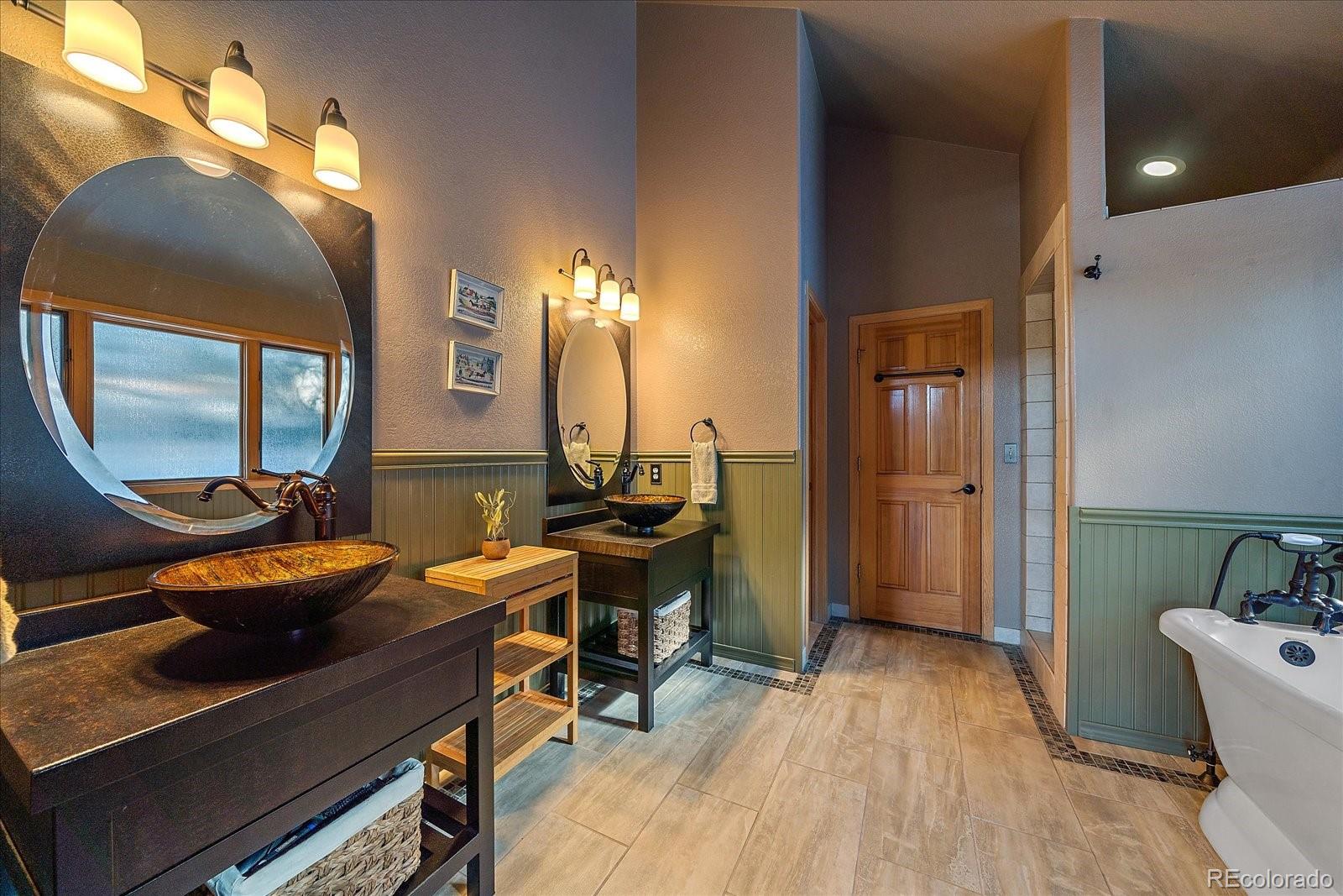 31196 Roberts Road Pine, CO 80470 - Photo 23 of 50 a room with furniture and wooden floor