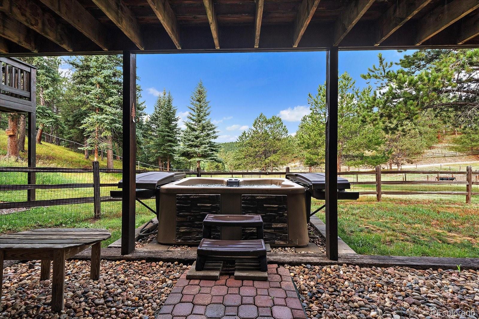 31196 Roberts Road Pine, CO 80470 - Photo 39 of 50 a view of a porch with furniture and yard