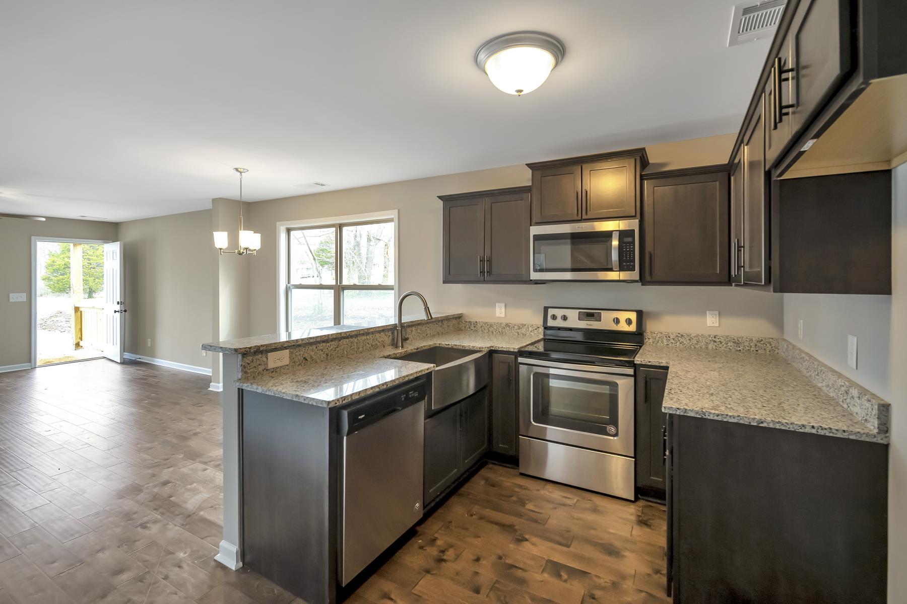 1240 B Bluebird Road Lebanon, TN 37087 - Photo 1 of 10 The kitchen has custom cabinets, granite tops, and SS appliances.