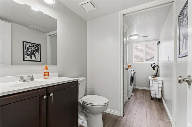 7975 Showcase Lane Sandy, UT 84094 - Photo 12 of 29 Half-bath on main level. Leads to Laundry area.
