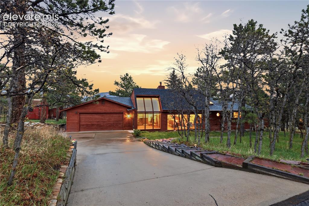 18190 Forest View Road Monument, CO 80132 - Photo 42 of 50 a view of a house with a yard