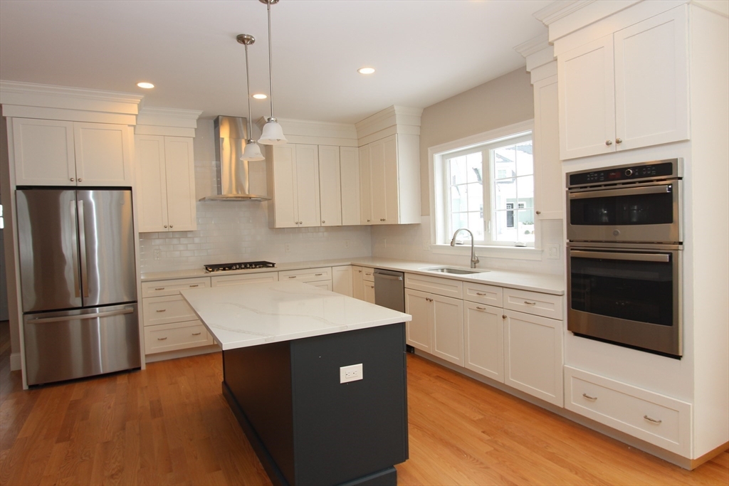 30 Weber Farm Road, Unit 30 Wrentham, MA 02093 - Photo 13 of 31 a kitchen with a refrigerator sink and cabinets