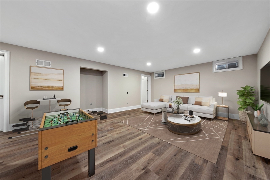 30 Weber Farm Road, Unit 30 Wrentham, MA 02093 - Photo 29 of 31 a living room with lots of furniture and a wooden floor