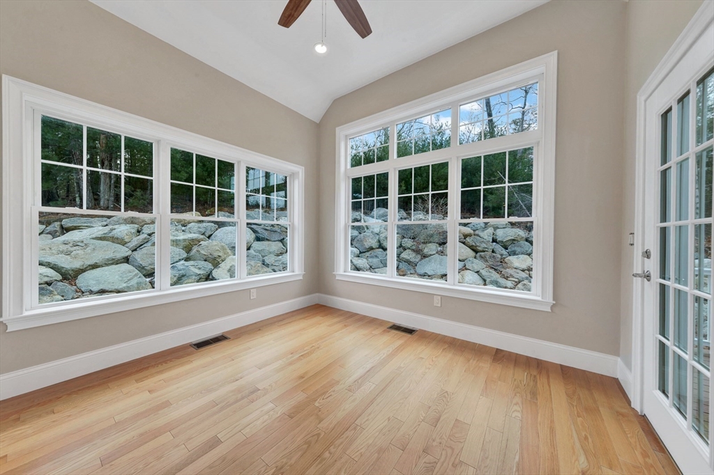 30 Weber Farm Road, Unit 30 Wrentham, MA 02093 - Photo 10 of 31 an empty room with wooden floor and windows