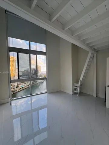 a bathroom with a shower and a sink