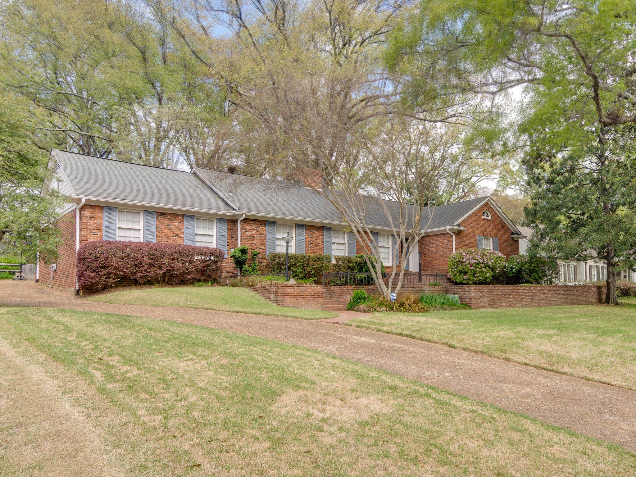 199 South Grove Park Road Memphis, TN 38117 - Photo 2 of 40 Ranch-style home featuring brick siding, a front lawn, and a shingled roof