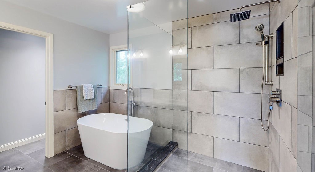 3161 Lander Road Pepper Pike, OH 44124 - Photo 13 of 26 Primary bathroom featuring walk-in shower and freestanding tub