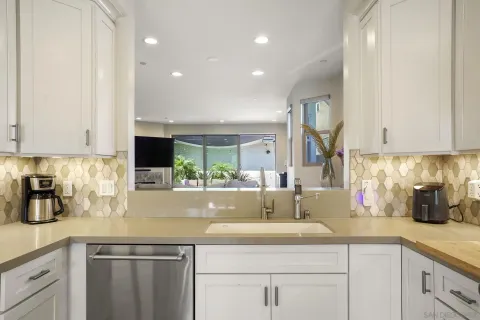 a kitchen that has a table and chairs in it