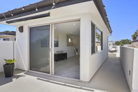 a front view of a house with yard and green space