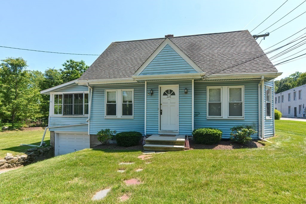 228 Pond Street Natick, MA 01760 - Photo 1 of 36 a front view of a house with a yard