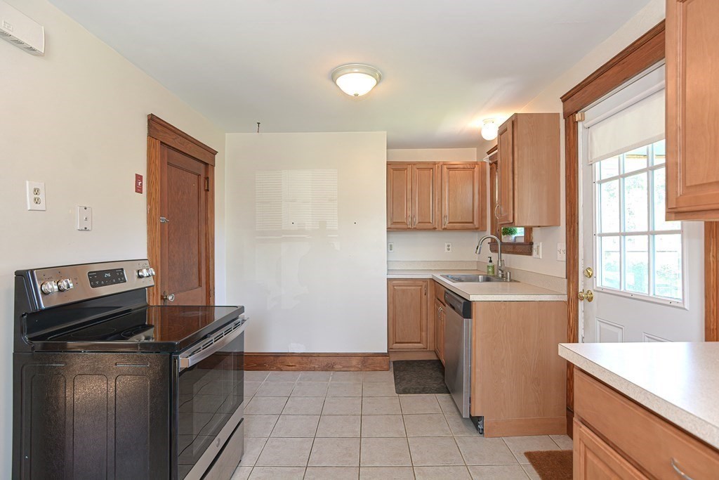 228 Pond Street Natick, MA 01760 - Photo 15 of 36 a kitchen that has a sink and a stove