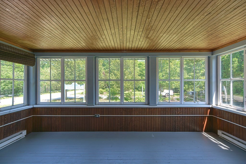 228 Pond Street Natick, MA 01760 - Photo 19 of 36 a view of an empty room with a window