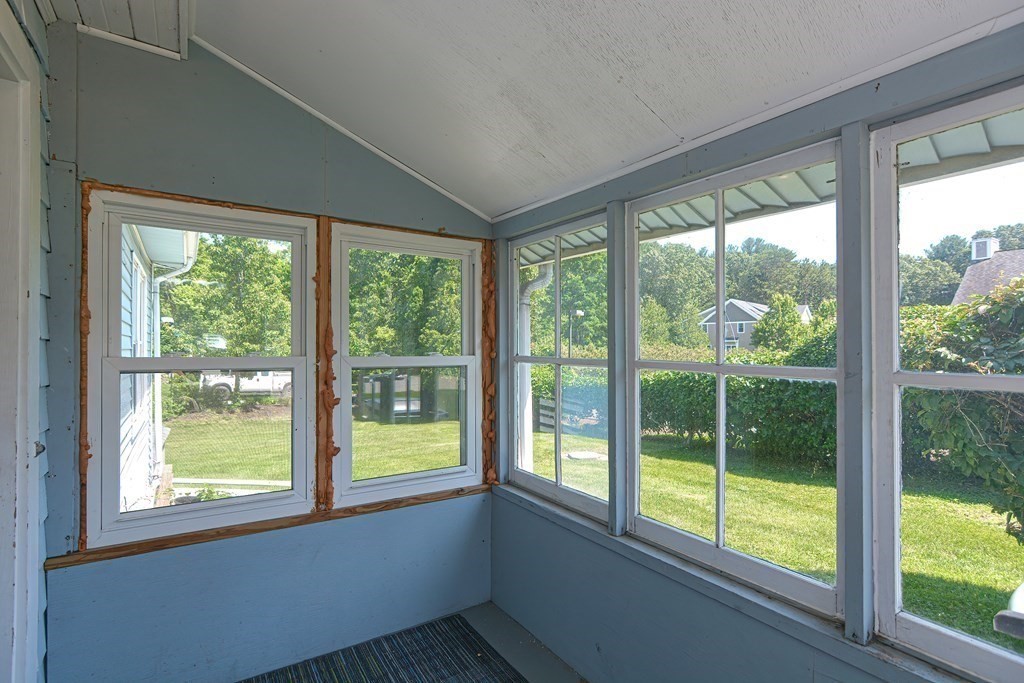 228 Pond Street Natick, MA 01760 - Photo 20 of 36 a view of an empty room with a large window