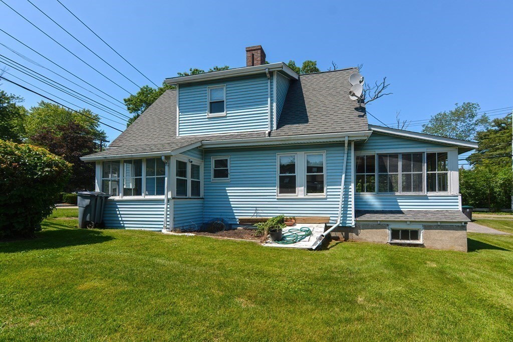 228 Pond Street Natick, MA 01760 - Photo 2 of 36 a front view of house with yard and outdoor seating