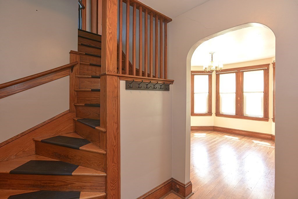 228 Pond Street Natick, MA 01760 - Photo 21 of 36 a view of front door with wooden floor
