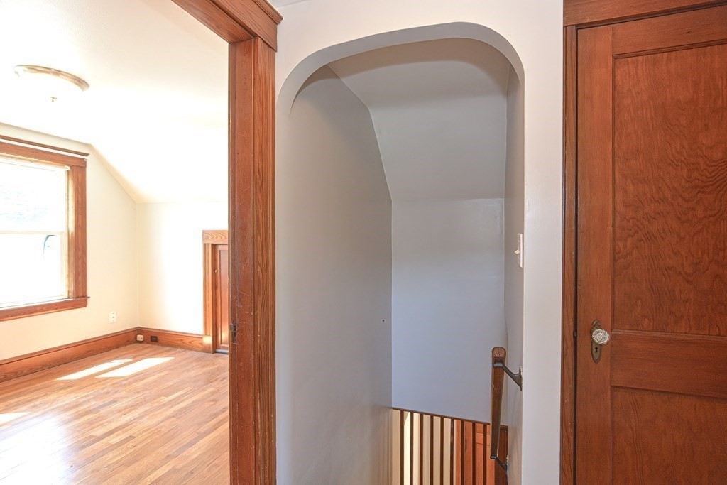 228 Pond Street Natick, MA 01760 - Photo 22 of 36 a view of a bedroom from a bathroom