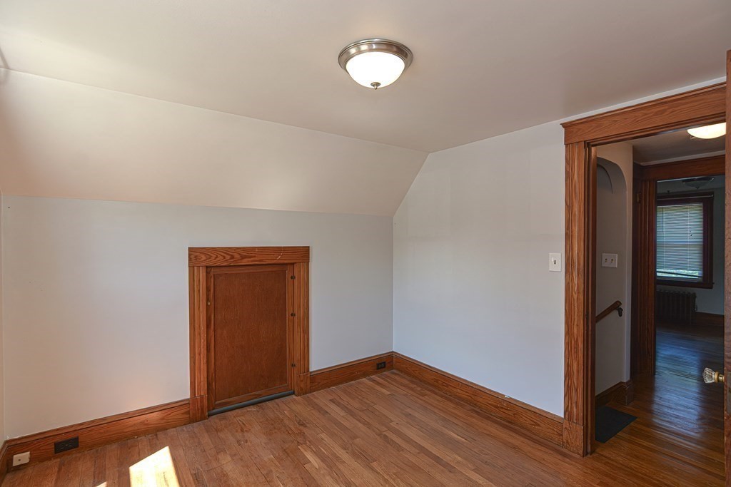 228 Pond Street Natick, MA 01760 - Photo 23 of 36 a view of empty room with wooden floor