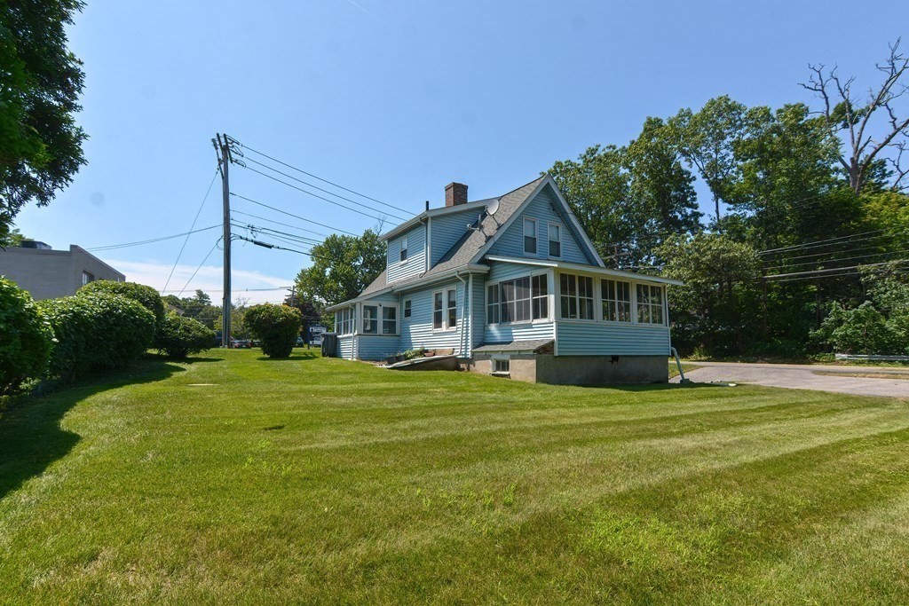 228 Pond Street Natick, MA 01760 - Photo 3 of 36 a view of a house with a yard