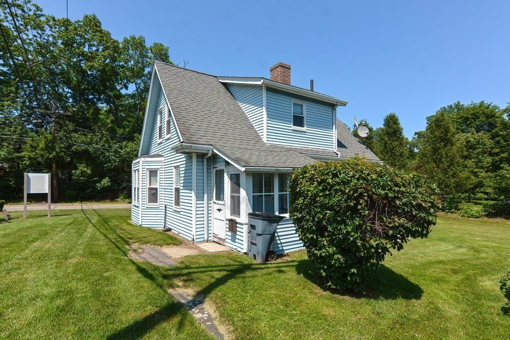 228 Pond Street Natick, MA 01760 - Photo 32 of 36 a front view of a house with a yard