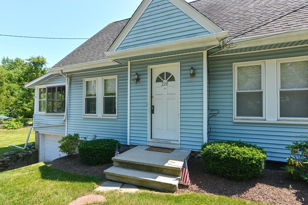 228 Pond Street Natick, MA 01760 - Photo 4 of 36 a front view of a house with garden