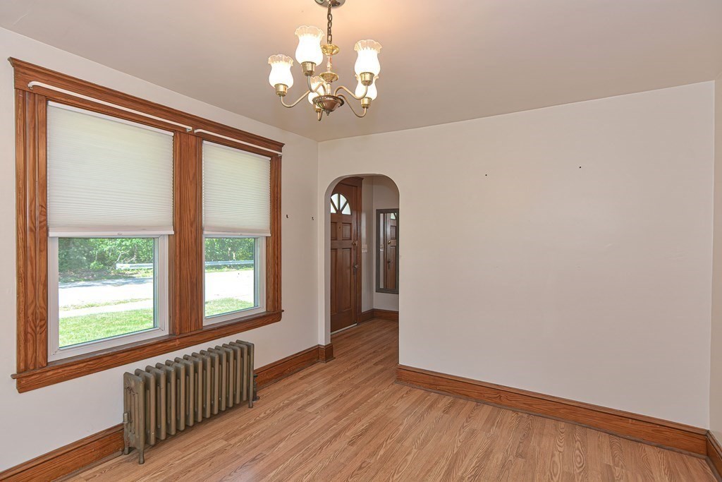 228 Pond Street Natick, MA 01760 - Photo 9 of 36 wooden floor in an empty room with a window