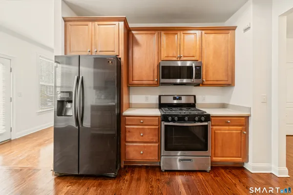 a kitchen with a refrigerator stove and microwave