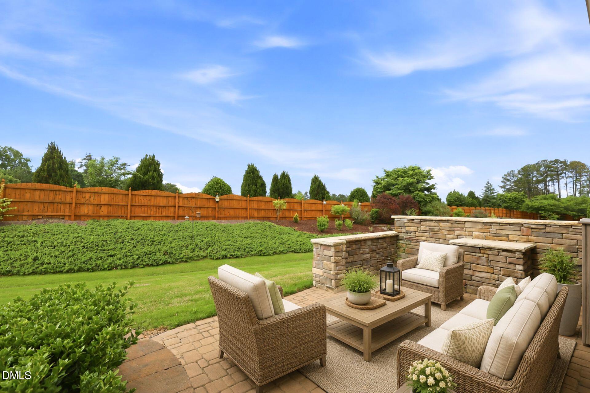 522 Brunello Drive Wake Forest, NC 27587 - Photo 15 of 24 a view of a patio with couches chairs and a table and chairs