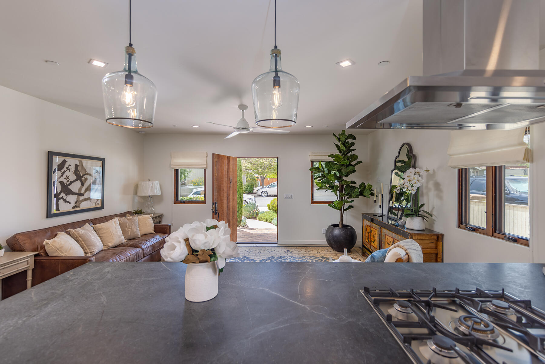 110 Fox Street Ojai, CA 93023 - Photo 3 of 30 a room with lots of white furniture a chandelier and a couch