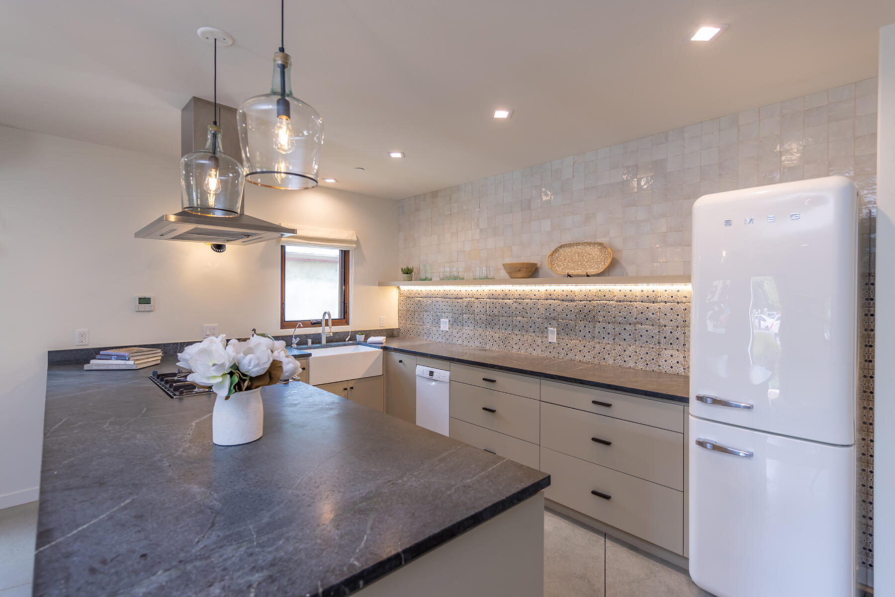 110 Fox Street Ojai, CA 93023 - Photo 6 of 30 a kitchen with granite countertop cabinets a sink a counter space and stainless steel appliances