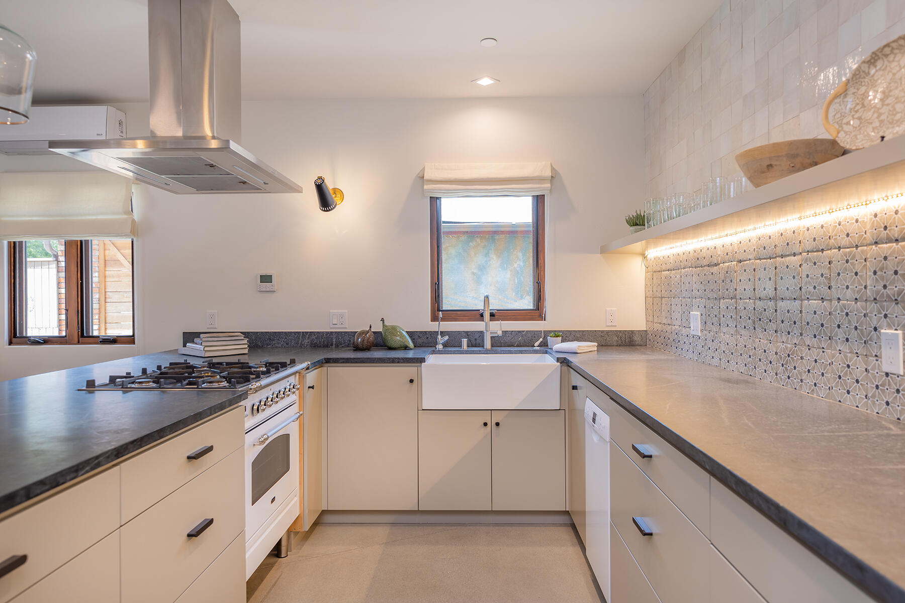 110 Fox Street Ojai, CA 93023 - Photo 7 of 30 a kitchen with a sink dishwasher and white cabinets with wooden floor
