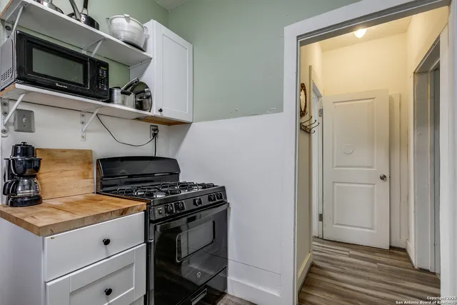 a kitchen with a stove and a microwave