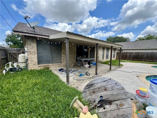 a view of a backyard with a patio