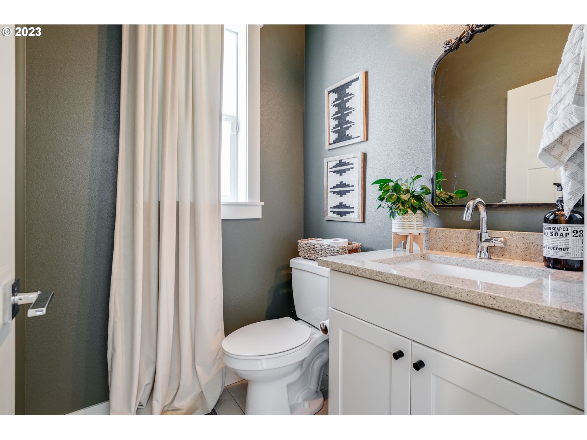 2889 4th Street Hubbard, OR 97032 - Photo 14 of 37 a bathroom with a granite countertop sink toilet and mirror