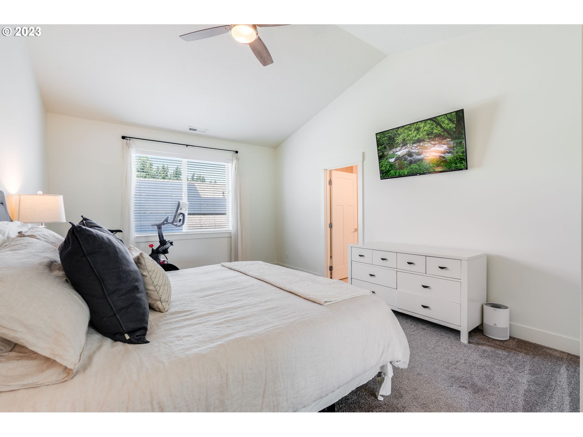 2889 4th Street Hubbard, OR 97032 - Photo 15 of 37 a bedroom with a bed and a night stand