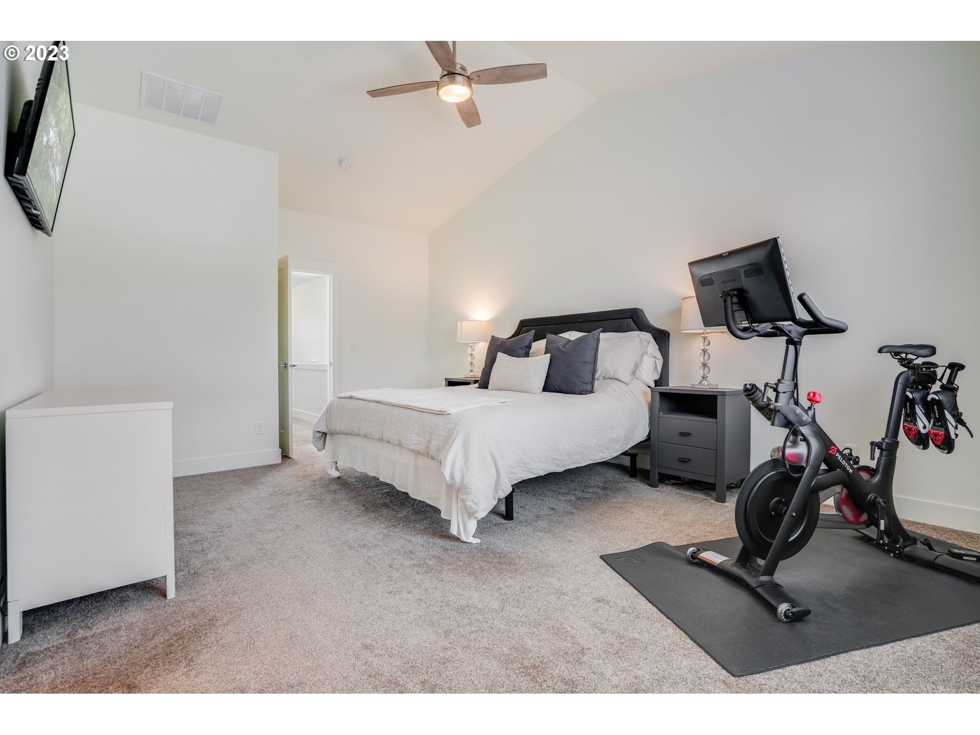 2889 4th Street Hubbard, OR 97032 - Photo 16 of 37 a bedroom with a bed and a desk