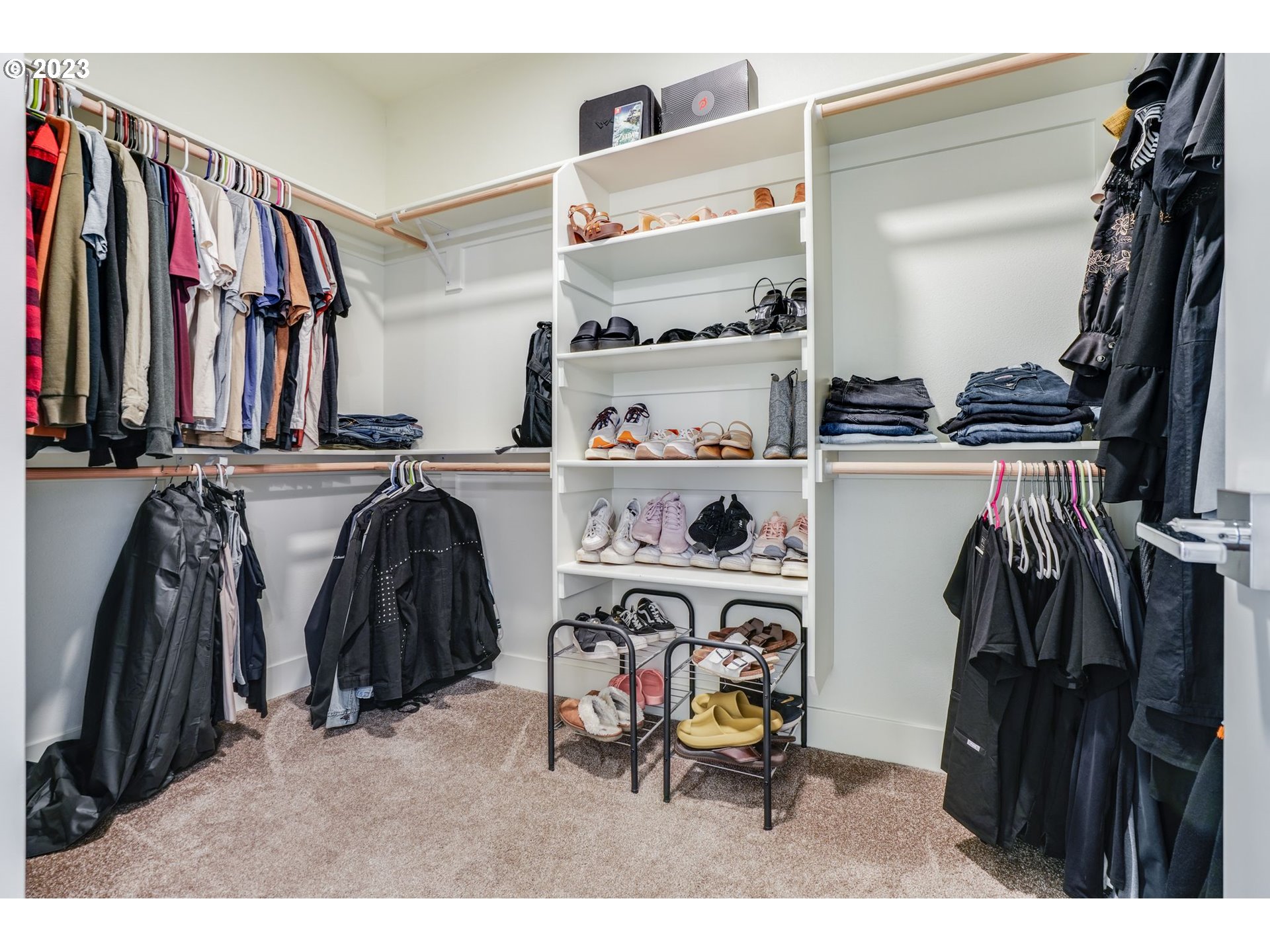 2889 4th Street Hubbard, OR 97032 - Photo 20 of 37 a view of walk in closet with clothes and shoes