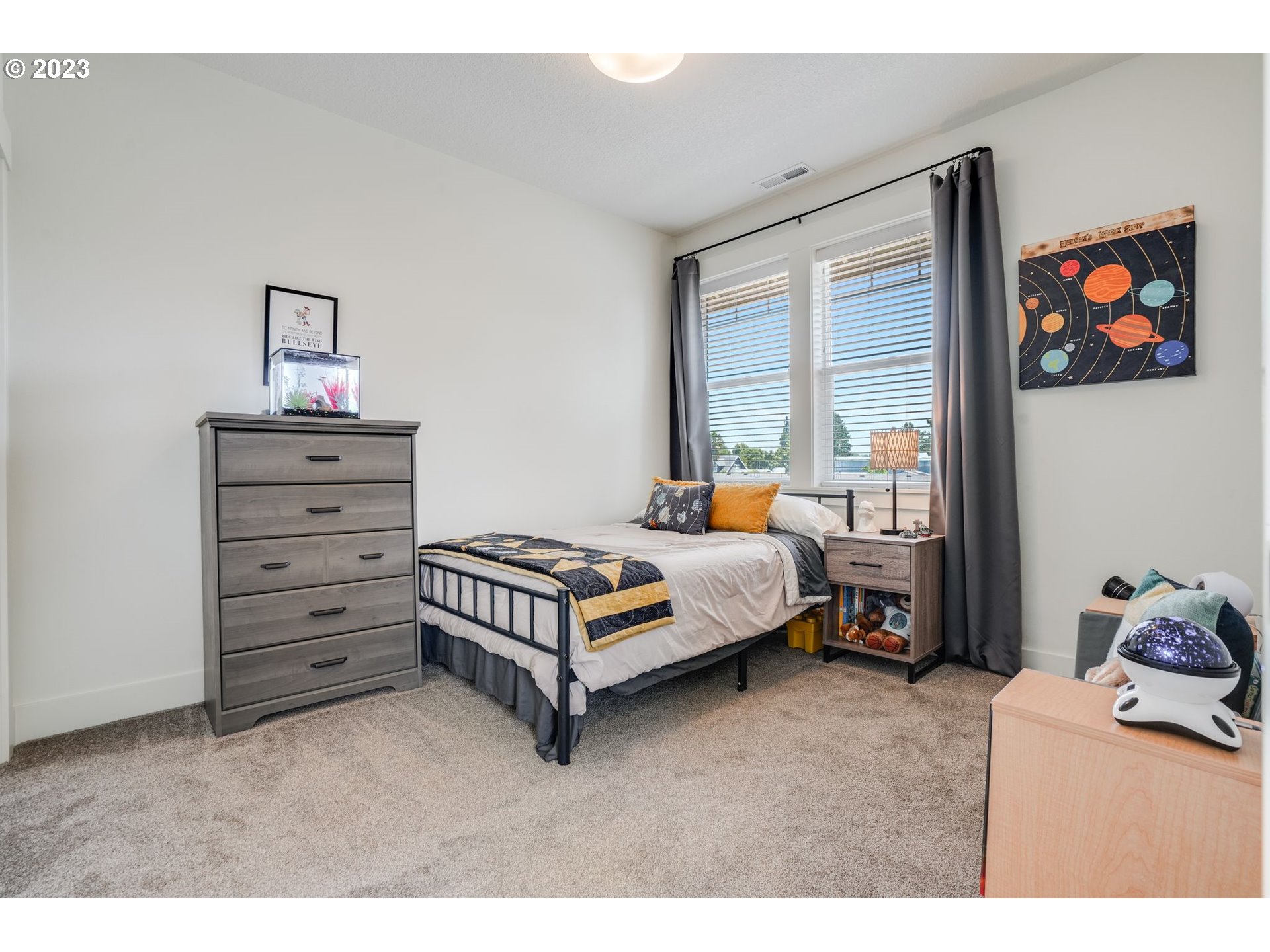 2889 4th Street Hubbard, OR 97032 - Photo 22 of 37 a bedroom with a bed and a window