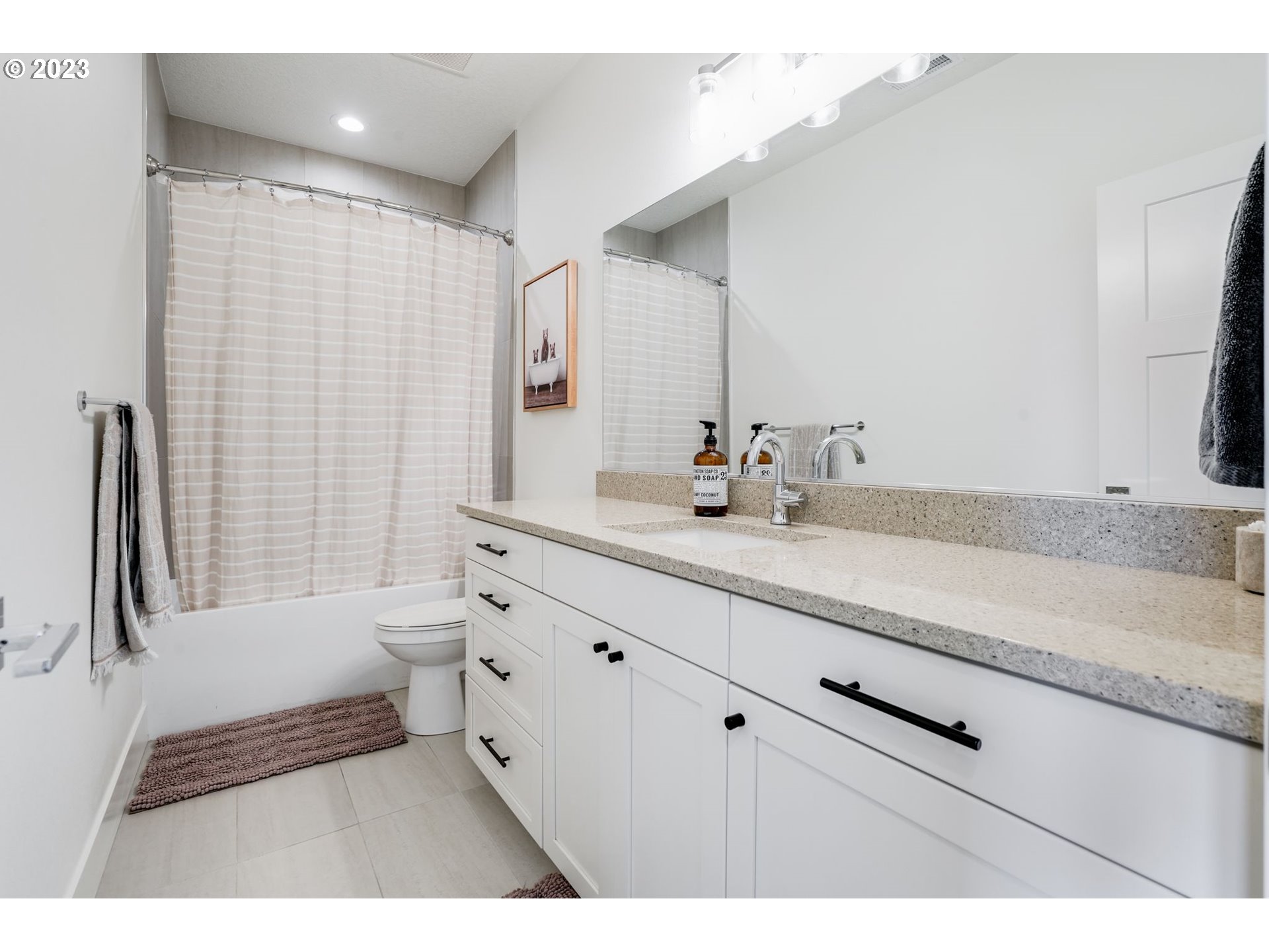 2889 4th Street Hubbard, OR 97032 - Photo 23 of 37 a bathroom with a sink double vanity granite tub shower and a mirror