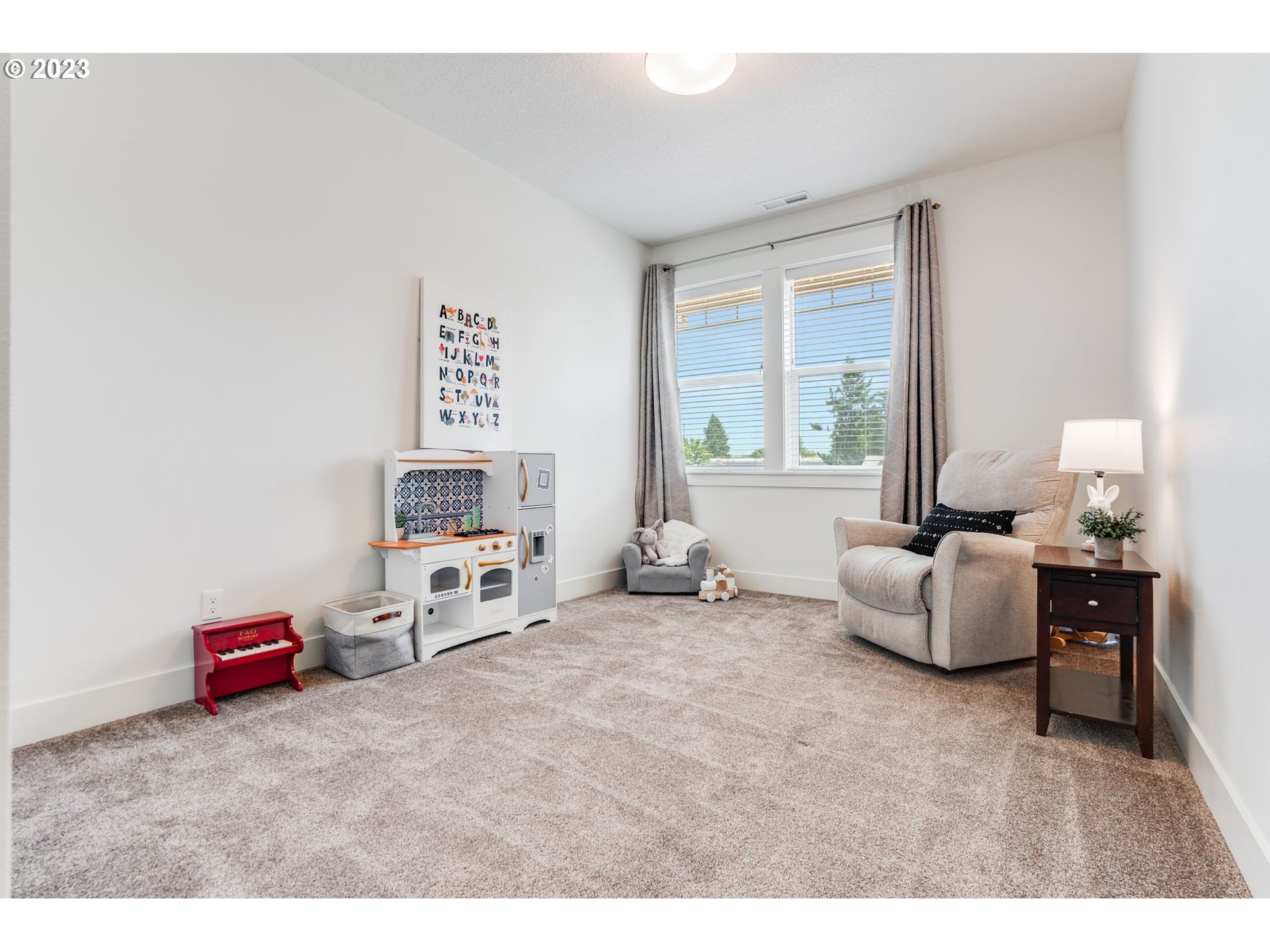 2889 4th Street Hubbard, OR 97032 - Photo 24 of 37 a living room with furniture and a window