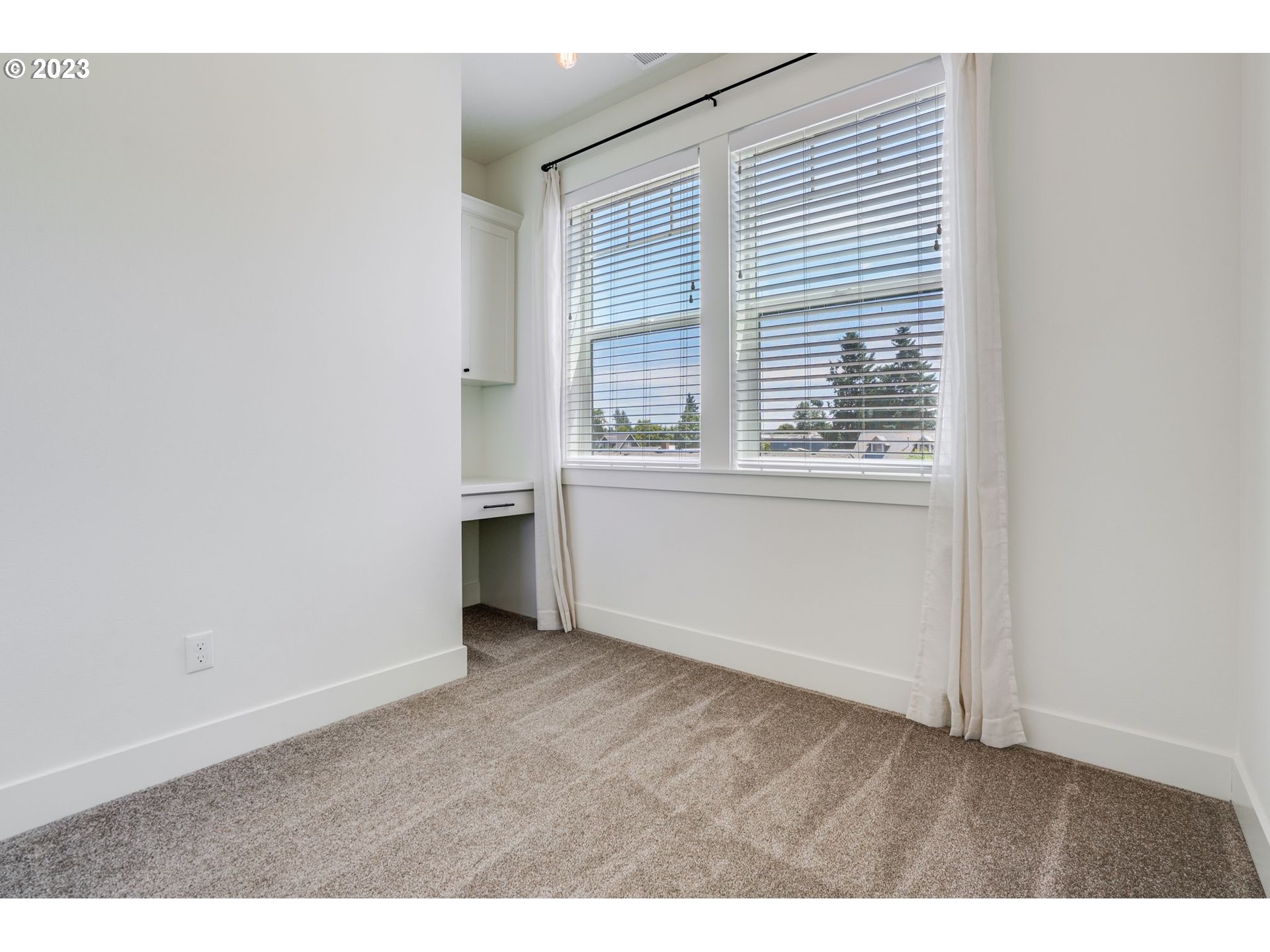 2889 4th Street Hubbard, OR 97032 - Photo 26 of 37 an empty room with wooden floor and windows