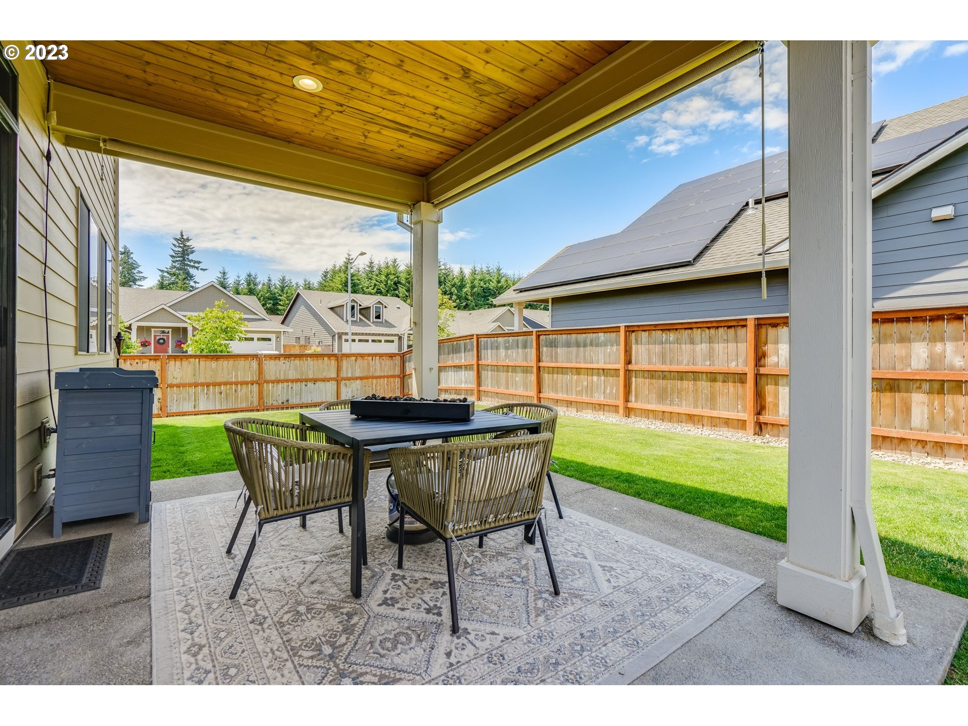 2889 4th Street Hubbard, OR 97032 - Photo 29 of 37 a view of a patio with a table chairs and a table