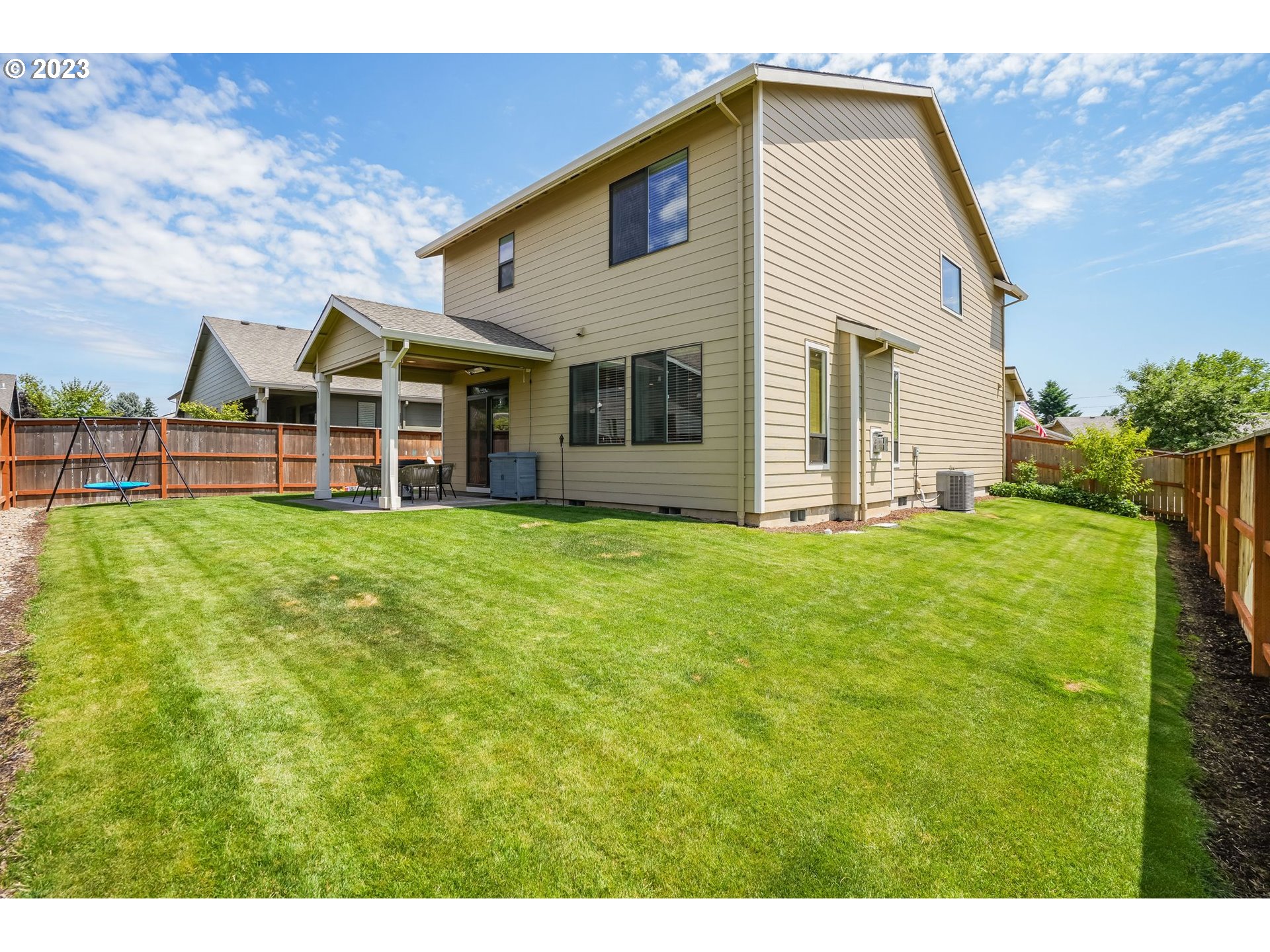 2889 4th Street Hubbard, OR 97032 - Photo 30 of 37 a view of a house with a yard and sitting area