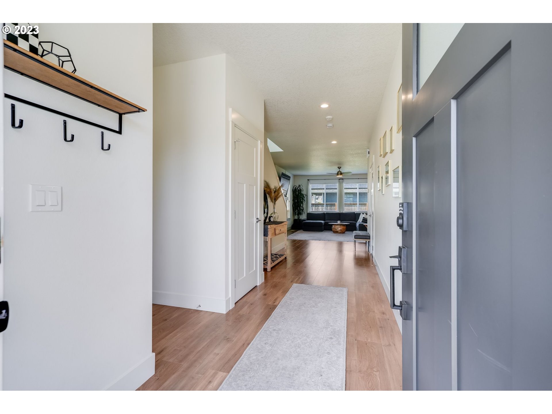 2889 4th Street Hubbard, OR 97032 - Photo 3 of 37 a view of kitchen living room with stove and refrigerator